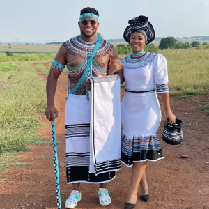 White, black, pink and blue his and hers ensemble