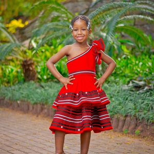 Red frilly one arm girls dress